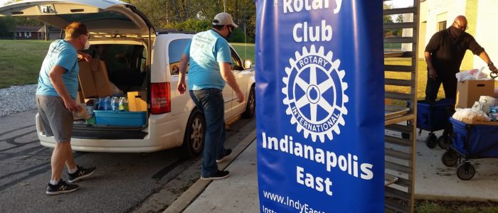 Members load food into vehicles at the October distribution at Sonny Day Warren Township